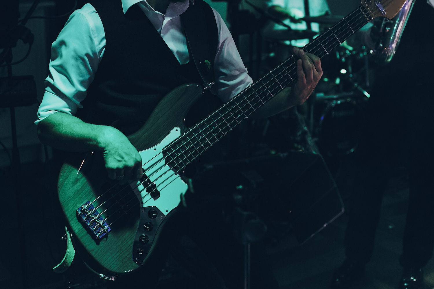 musician playing guitar at wedding reception